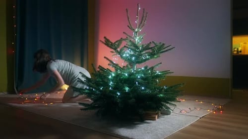 Woman and Child Decorating for Christmas at Home