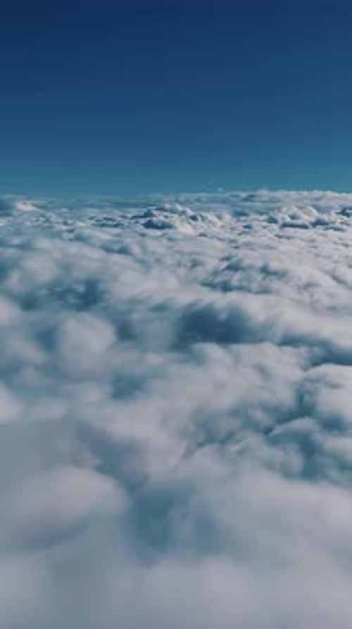 Clear, Blue Sky Above The Clouds. Vertical Format