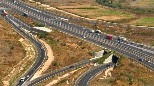 Highway traffic on multiple highways roads with traffic on all roads, Aerial footage