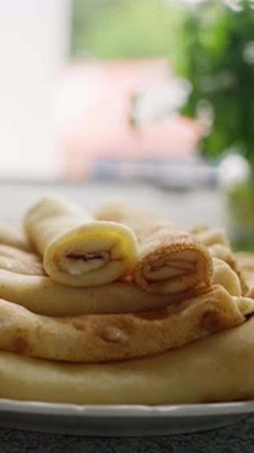 Golden Pancakes Stacked High on Plate