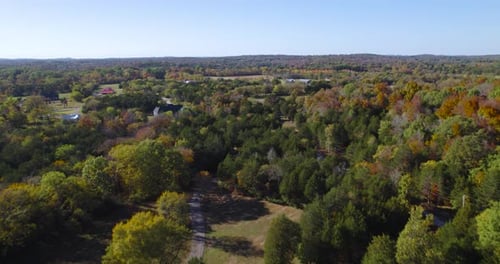 Quiet Neighborhood With Forest During Fall Season On A Sunny Day In Tennessee. - aerial shot