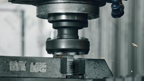 Metal Machine Cuts Through Metal Block
