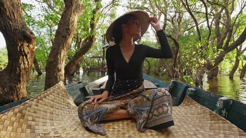 Woman Riding A Boat In The Mangroves