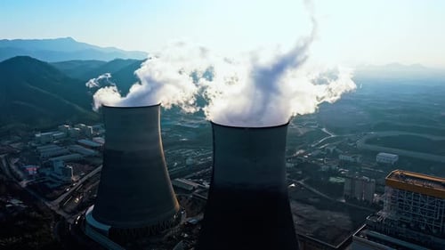 erial view of chimneys of power plant, an industrial district. Modern large thermal power plant
