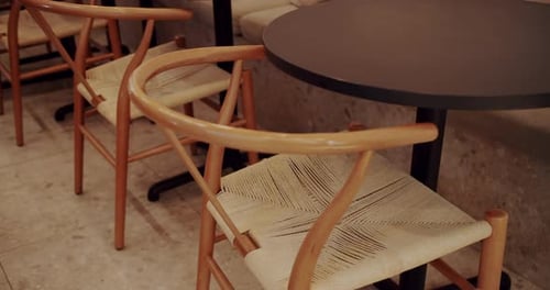 Indoor Cafe with Tables and Wooden Chairs