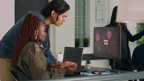 Diverse Team Troubleshooting Critical Error in Modern Office