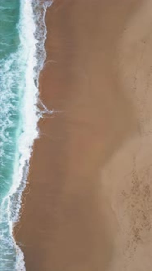 Vertical View Rough Waves Making White Foam Stormy Sea Surf Rolling Sandy Coast