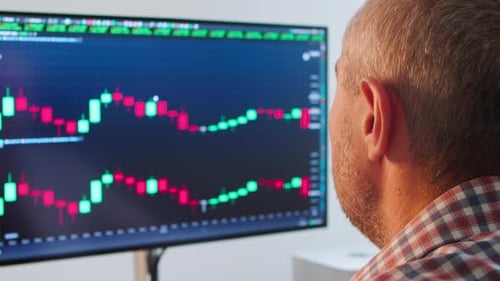 Male Financial Analyst Checking Stock Market Data Computer Analyzing Investment