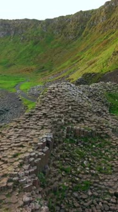 Social ratio aerial video of the colums at The Giant's Causeway in Bushmills, Northern Ireland