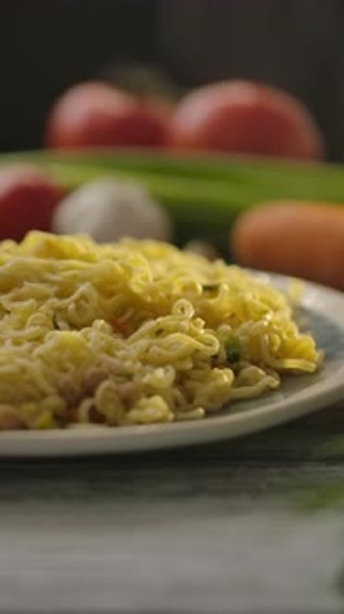 Appetizing noodles on a plate with vegetables