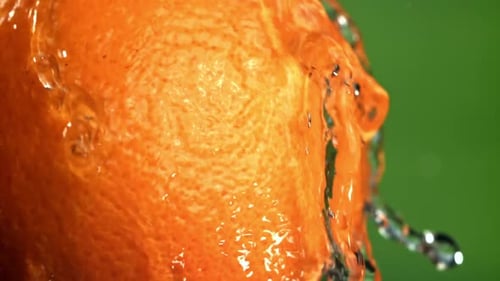 Water Drips Down From a Ripe Orange Filmed on a Highspeed Camera at 1000 Fps