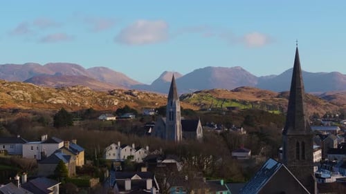 Aerial drone footage of St Joseph’s Church and Christ Church Clifden with Connemara Mountains