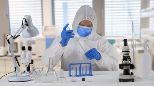 Scientist in Hazmat Suit Conducting Medical Research