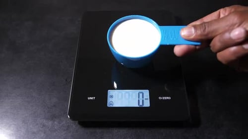 Measuring Cup of Liquid on a Digital Scale