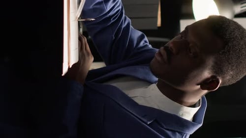 Focused Adult Working in Office Writing