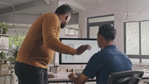 UX Designer Helping Coworker with Mobile App Project