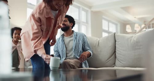 Happy Family Relaxing Together on Couch Indoors