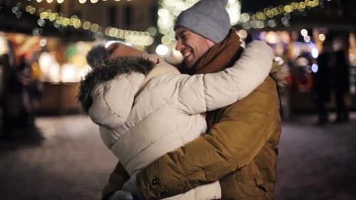 Happy Couple Embracing at Festive Night Market