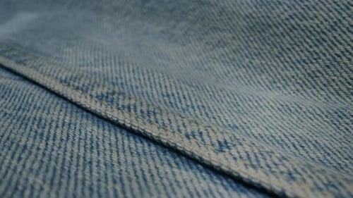 Macro Shot of Blue Denim Material with Seam