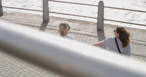 Lesbian, couple and kiss on beach with love, romance and hug for holiday