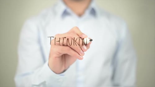 Hand Writing the Word THINKING