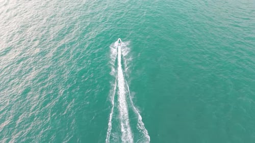 Jet Ski Glides Across Turquoise Ocean Waters