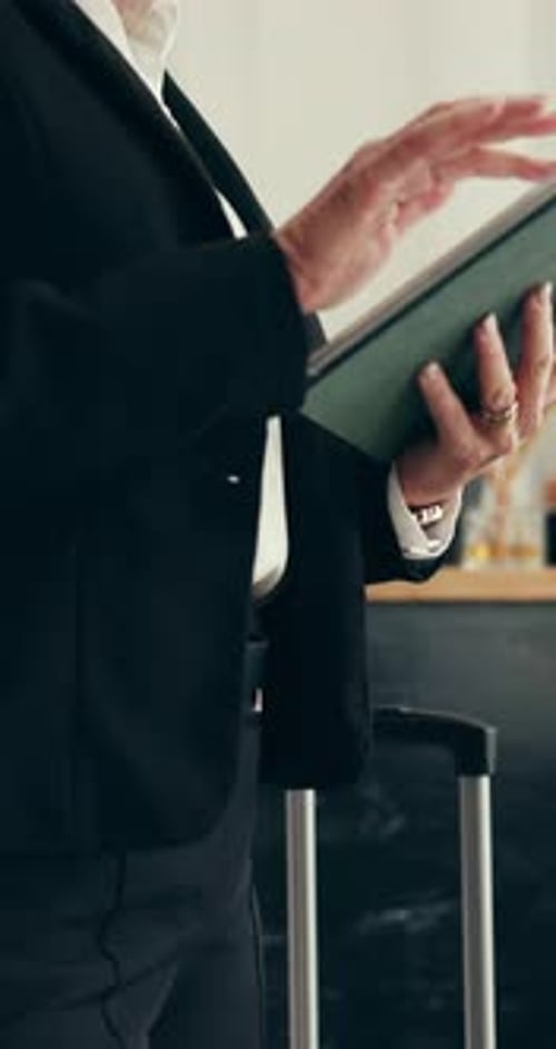 Business, woman and reception with tablet at hotel for check in, reservation and confirm booking