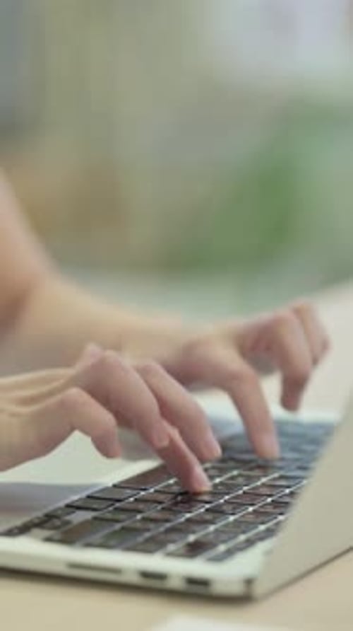 Close up of Female Hands Typing on Laptop, vertical video