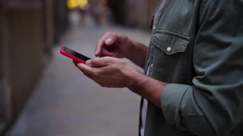 Close Up of Hands of an Unrecognizable White Man Using Phone to Be Connected One Social Media Apps