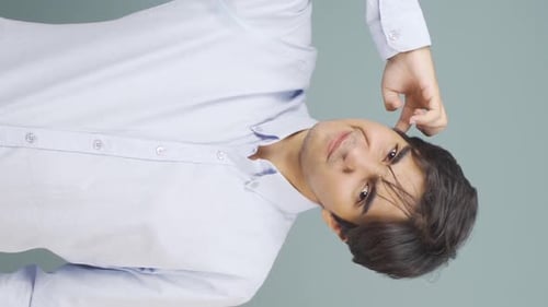 Young Adult Scratching Head, Portrait Shot