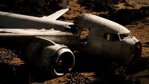 Aircraft Wreckage After Crash Site in Remote Terrain During Daylight