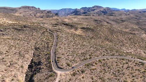 Aerial view of winding road through desert landscape, United States.