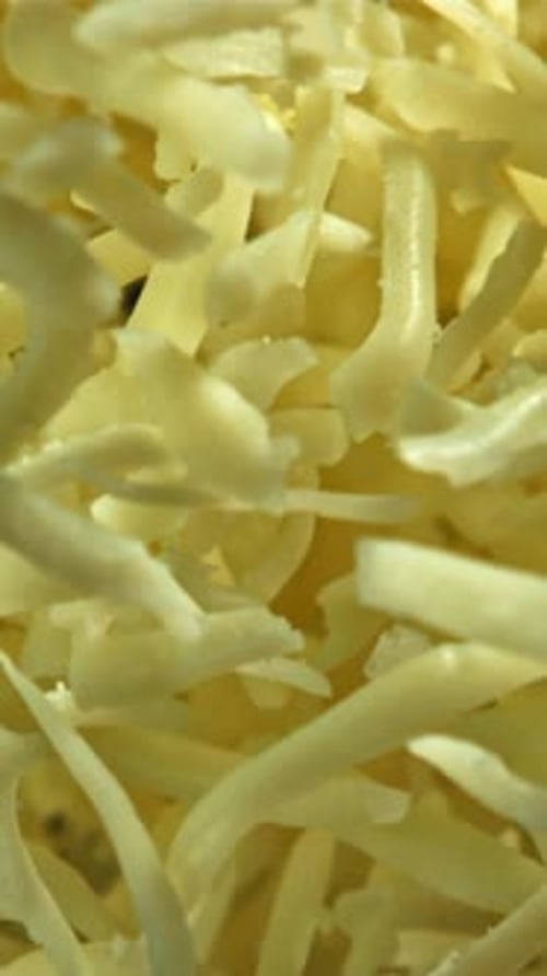 The Grated Cheese Flies Up and Down Filmed on a Highspeed Camera at 1000 Fps