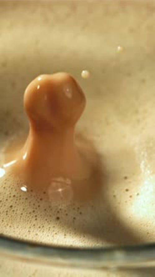 Falling Drop in a Cup of Coffee Filmed on a Highspeed Camera at 1000 Fps