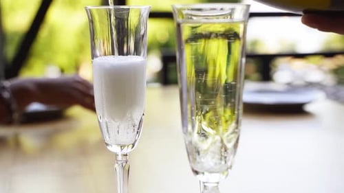 Champagne Pouring into Crystal Flutes for Celebration