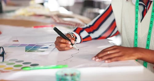Designer Drawing a Clothing Pattern in the Studio