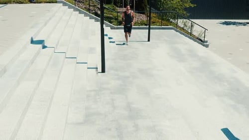 Young Man Running in Urban Area