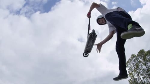 Tailwhip on scooter low angle shot
