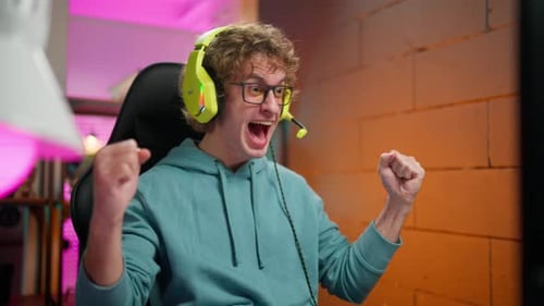 Excited Young Adult Gamer Celebrating Victory