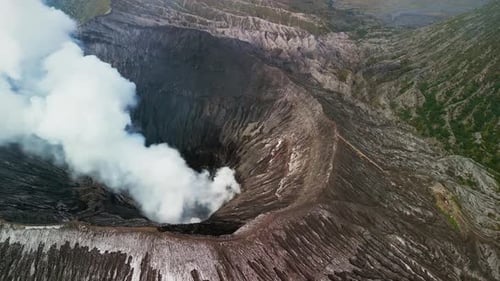 Aerial Drone Footage of Mount Bromo Volcano in East Java with Smoking Crater and Caldera
