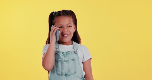 Happy, phone call and child in studio talking for online chatting, speaking and contact