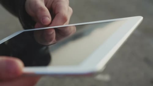 Closeup of Female Hands Touching Digital Tablet with Business Diagram