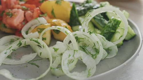 Colorful Salad Preparation with Fresh Tomatoes and Onions