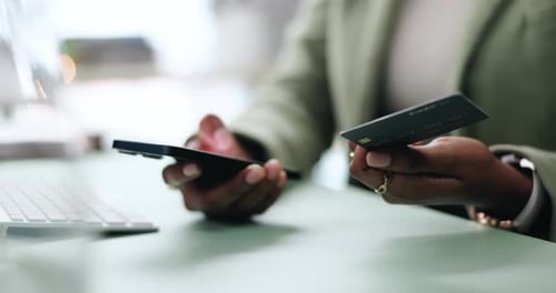 Close Up Of Adult Using Phone and Credit Card