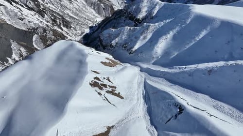 Aerial view of beautiful snowy mountains in Gudauri, Georgia