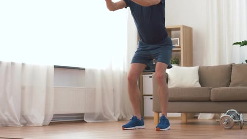 Man Doing Squats for Exercise at Home
