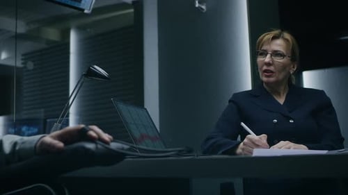 Man Attached to Lie Detector Being Questioned