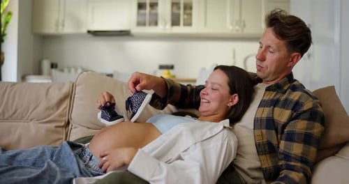 Happy Couple Expecting Baby at Home