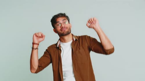 Young Adult Man Dancing and Smiling
