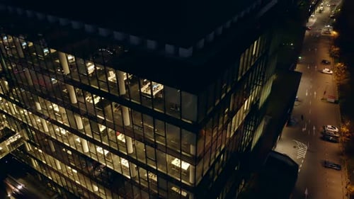 Aerial Panorama of Nighttime Corporate World in Glass Skyscrapers